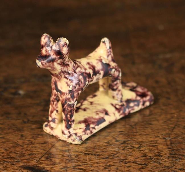 A Small 19th Century 'Whieldon Type' Pottery Whistle modelled as a dog sponged with manganese glaze