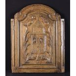 An 18th Century Continental Carved Oak Arch-topped Cabinet Door with moulded borders framing a