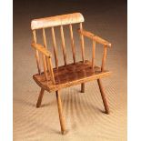 A 19th Century Comb Back Windsor Armchair.