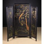 A 19th Century Black Lacquered Three-fold Dressing Screen decorated in the chinoiserie style with