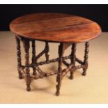 A Charles II Style Oak Gateleg Dining Table.