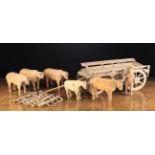 A 19th Century Toy Pine Wagon with Driver and Five Oxen. The wagon 6½" (16.