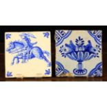 Two Blue & White Tiles: A 17th century tile painted with an urn of fruit to the centre and