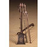 A Set of 19th Century Iron Fire Tools: A Poker, Tongs and Shovel with pierced pan,