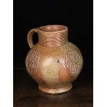 A Fine 16th Century Raeren Stoneware Armorial Jug.