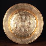 An Early 16th Century Nuremberg Brass Repoussé Alms Dish.