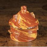 A 19th Century Slip-glazed Agate-ware Money Box modelled in the form of a circular inn with a