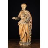 An Early 18th Century Wood Carving of Joseph carrying the Infant Jesus,