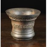 A 17th Century English Bronze Marriage Mortar cast with a decorative band of trefoil motifs above