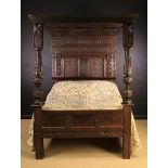 An Attractive 17th Century Style Oak Full Tester Bed enriched with elaborate carving and inlaid