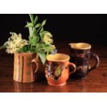 Three Decorative 19th Century French Slipware Jugs with yellow glazed interiors: One with marbled