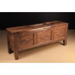 A 17th Century Joined Oak Coffer of unusual proportions.