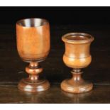 Two 18th Century Treen Goblets: An early 18th century fruitwood goblet with ring turned decoration