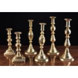 Three Pairs of 19th Century Brass candlesticks with decoratively knopped stems; 11¾ in (30 cm),