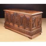 A Large Carved Oak Side Cabinet fashioned as a late 16th century coffer.