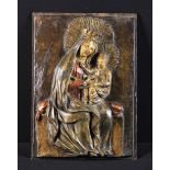 A 17th/18th Century Polychromed Stucco Relief Panel depicting Madonna & Child,