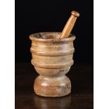 A Late 17th/Early 18th Century Turned Treen Mortar with later pestle.