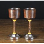 A Fine Pair of Modern Rosewood Goblets with bat-wing turning to the underside of the plain bowls