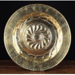 A 16th Century Repoussé Brass Alms Dish.