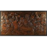 A Large Carved Oak Single Piece Panel of impressive proportions depicting a indulgent scene of