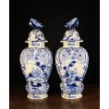 A Pair of Large Late 18th Century Blue & White Delft Lidded Vases of octagonal baluster form.
