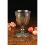 A Fabulous 17th Century Turned Lignum Vitae Goblet decorated with engine turning to the foot,