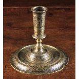 An Early 17th Century Veneto-Saracen Bronze Candlestick elaborately carved & engraved with a