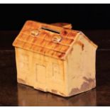 A Late 19th Century Stoneware Money Box modelled in the form of a house, 3¼ in (8 cm) high,