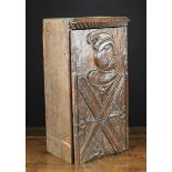 A Small Oak Cabinet of rectangular form incorporating a 17th century panel door relief-carved with