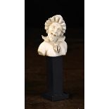 A Small 19th Century Carved Ivory Bust of an Old Hag wearing frilled bonnet,