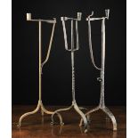 Three 18th Century Style Wrought iron Peermen with sprung rush holders and candle-sockets on tripod