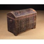 A 19th Century Dome-topped Leather-clad Trunk adorned with brass stud-work and standing on integral