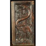 A French 16th Century Carved Oak Panel depicting a wyvern stamped with punchwork,