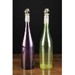 A Pair of Victorian Coloured Glass Bottles with silver mounts hallmarked Birmingham 1839.