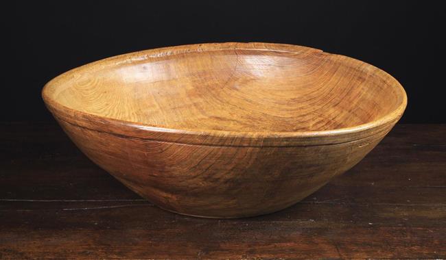 A Large 19th Century Turned Ash Dairy Bowl, 6¾" (17 cm) high, 23" (59 cm) in diameter.