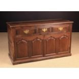A Late 18th Century Joined Oak Low Dresser fitted with three edge-moulded frieze drawers with