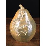A Glazed Stoneware Pear-shaped Money Box with thick white slip-glaze inscription;