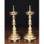 A Pair of 17th Century Style Pricket Candlesticks with knopped stems and round stepped bases raised