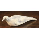 A 19th Century Carved Pine Decoy Pigeon with residual paint-work and iron screw eyes,