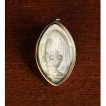 A Late 18th Century Navette Shaped Memorial Pendant meticulously painted in sepia with a pedestal