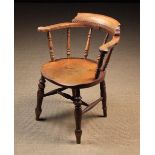 A Victorian Smoker's Bow Armchair.