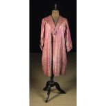 A Fine Vintage Hand-stitched Indian Coat woven with repeated gold botehs on a magenta ground and