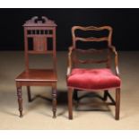 Two Chairs: A Late Victorian hall chair with a crested top rail above row of turned spindles and
