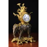 A Fine Bronze & Gilt Bronze Elephant Clock in the Louis XV Style.