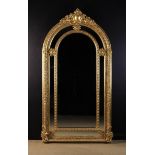 A Large Arch-topped Gilt Wall Mirror.