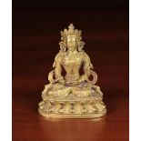 A Small 19th Century Gilt Metal Buddha, 4" (10 cm) in height.