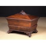 A William IV Mahogany Wine Cooler of sarcophagus form.