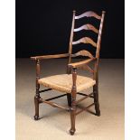 A Vintage Rush-seated Ladder-back Armchair.