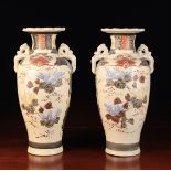 A Pair of Japanese Satsuma Garniture Vases, 13" (33 cm) in height.