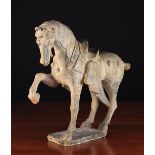 An Antique Painted Pottery Tang Horse with restoration, 18" (46 cm) high, 20" (51 cm) in length.